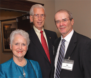 Dr. Bill Koopman (right) with Mr. Elmer Harris, former CEO of Alabama Power, and his wife, Glenda, at an event honoring Dr. Koopman.