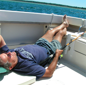 Dr. Coblyn catching rays on his 20-foot speed boat.