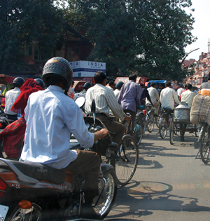 Traffic in India is chaotic, with many vehicles, including those that would be deemed unsafe in the U.S., crowding the busy streets.