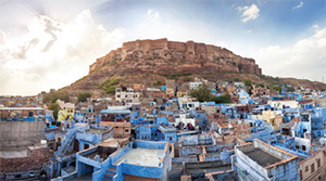 Blue City and Mehrangarh Fort on the hill at sunset in Jodhpur, Rajasthan, India.