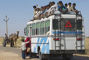 Passengers crowd a bus in Jamba, India. Public transportation in the Great Thar desert, Rajasthan, is usually overloaded.