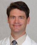 headshot of Angus Worthing, MD, FACR, FACP