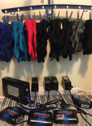 Figure 3: My battery-charging station and knit-glove collection. Knit gloves worn over the heated glove (liners) provide extra protection for the fingertips and keep the gloves clean.