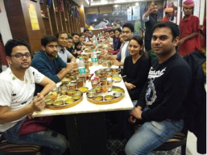 Dr. Bhatt (left side, striped shirt) and the Sanjay Gandhi Postgraduate Institute of Medical Sciences rheumatology fellows at a farewell dinner.