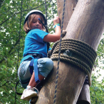 A camper tackles the rope course at Camp Wekandu. Activities are adapted to the campers’ ability levels.