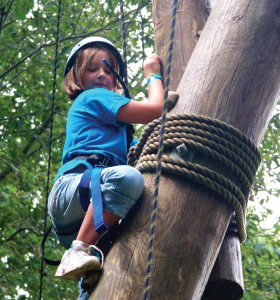 A camper tackles the rope course at Camp Wekandu. Activities are adapted to the campers’ ability levels.