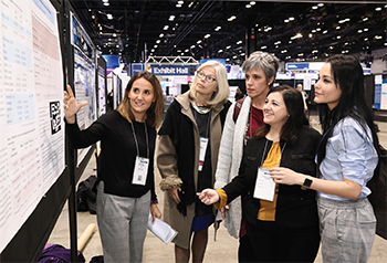 The Poster Hall drew crowds as researchers presented their work and findings.