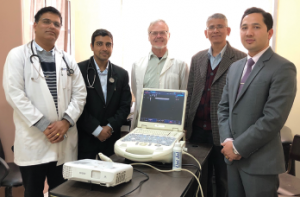 Physicians stand behind the ultrasound Dr. Paul Halverson brought to Patan Hospital, Nepal, for the new rheumatology training program. From left: Drs. Keshav Raj Sigdel, Ujjwal Risal, Paul Halverson, Buddhi Paudyal and Jiwan Poudel.