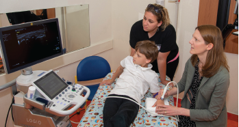 Ms. Benham performs an ultrasound scan on a patient with juvenile idiopathic arthritis.
