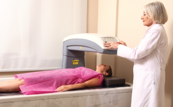 A woman being examined for bone density.