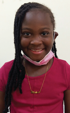 Featured on the booklet cover, Tishae Amya Evelyn was diagnosed with acute cutaneous lupus and alopecia in June 2020 at the age of 6.