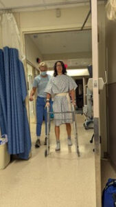 Dr. Samantha Shapiro, two weeks post-op, shown using a walker.