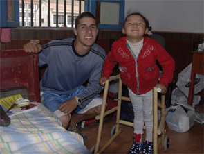 Ariel Bacharach and a Tibetan girl who received one of the walkers he built.