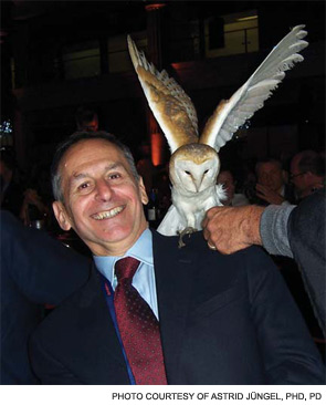 Dr. Pisetsky is visited by an owl, held by one of the Harry Potter character actors.