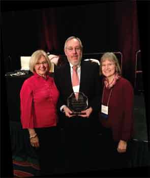 Dr. Hochberg receiving the OARSI Lifetime Achievement Award in 2013, with Drs. Linda Sandell and Virginia Kraus.