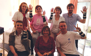 Group picture of therapists in Skopje wearing fabricated wrist orthoses.