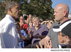 Joe the Plumber asks Barack Obama a question about taxes during a campaign stop.