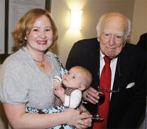 Dr. Engleman (right) is pictured with the first recipient of his named award, Dr. Perkins, who is holding her son.
