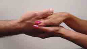 Figure 3: Sandwich the patient's hand between your hands to embrace but not squeeze the hand.