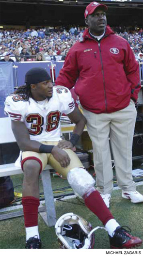 Dashon Goldson (left) of the San Francisco 49ers is iced for an injured knee.