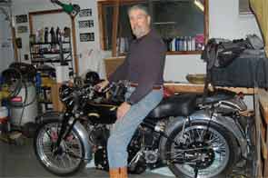 Dr. Rochmis on in his workshop on his 1953 Vincent Black Shadow motorcycle.