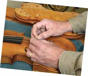 Dr. Higgs stringing a violin