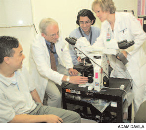 One of the challenges at Grady is providing a quality training experience with limited staff and older equipment. Pictured (left to right) are INTERN 1; Dr. Conn; INTERN 2; and Joyce P. Carlone, MN, RN, CFNP.